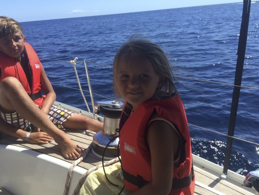 Alcudia: Sailing Yacht Excursion with Wine & Tapas - Cala en Gossalba break: swimming, snorkeling, SUP, and lunch onboard