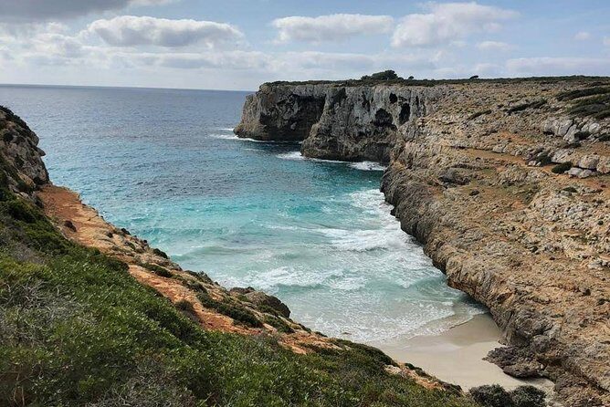 Cala Romantica Water Cave Adventure - Abseiling and entering the cave: how you go from sea air to stalactites