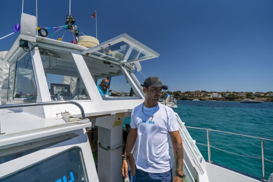 El Arenal, Mallorca: Bay of Palma Boat Tour with Snorkeling - Traditional boat comfort: showers, WC, life jackets, and practical onboard details