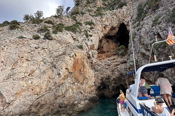 Mallorca Beach & Caves 4hr Boat Trip Drinks, Tapas, SUP & Snorkel - Alcanada Lighthouse and the final swim: snacks, drinks, and sun time