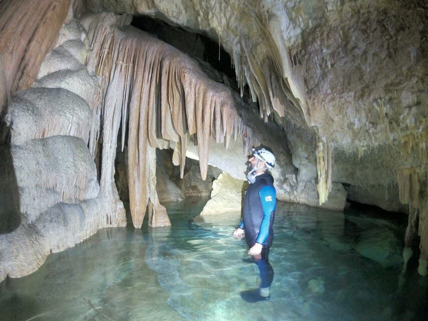 Mallorca: Cala Romántica Cliff Hike and Sea Cave Tour - Neoprene up at the cove, then the 300-meter swim to the cave