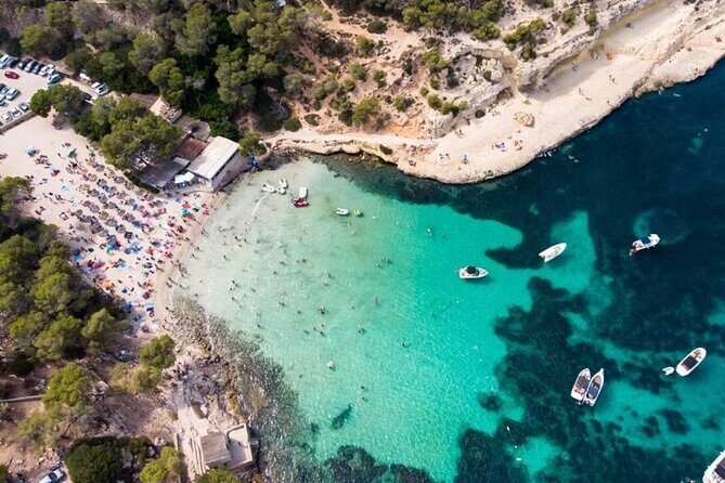 Tour Beach Portal Vells, Cave Portal Vells. - Platgeta de Portals Vells Sea Caves: the payoff, with rocky footing