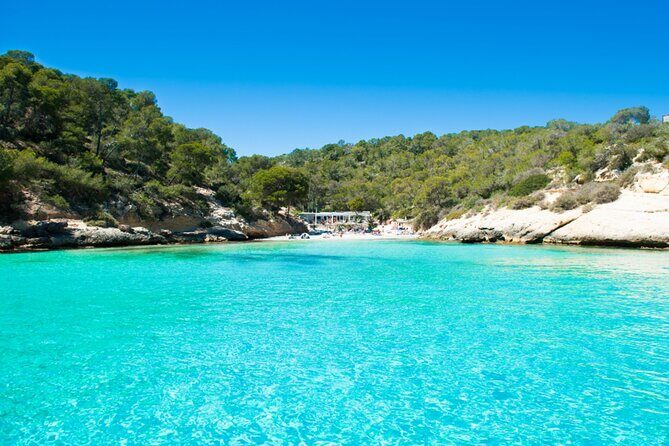 Tour Beach Portal Vells, Cave Portal Vells. - 9:00 pickup, A/C vans, and chilled comfort