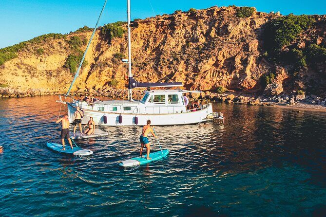 Traditional Mallorquin Llaut Cruise with Tapas and Drinks - The cove routine: swimming, snorkelling, and playtime from the boat